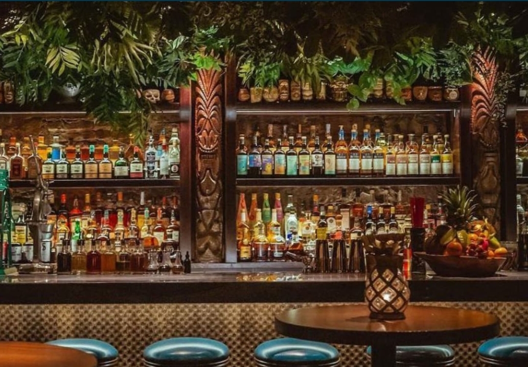 Warm, ember-lit lounge interior